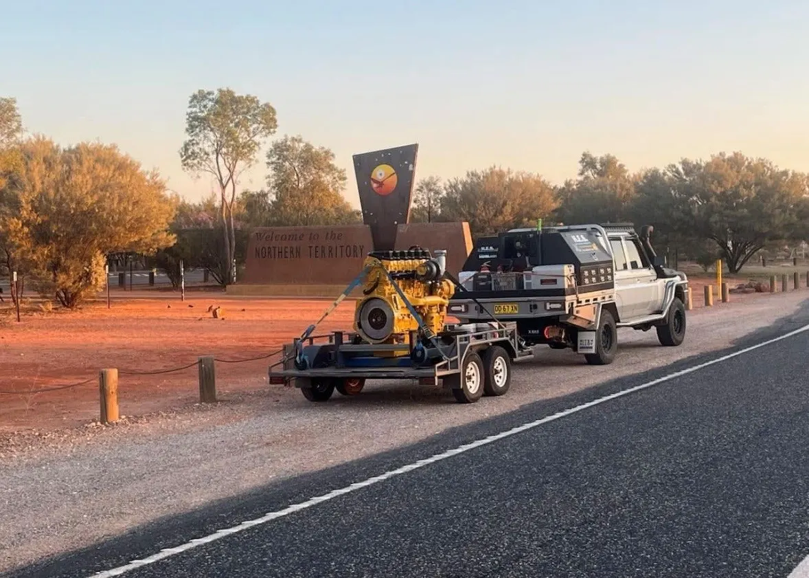 HES field service ute towing a rebuilt diesel engine on a trailer in outback New South Wales