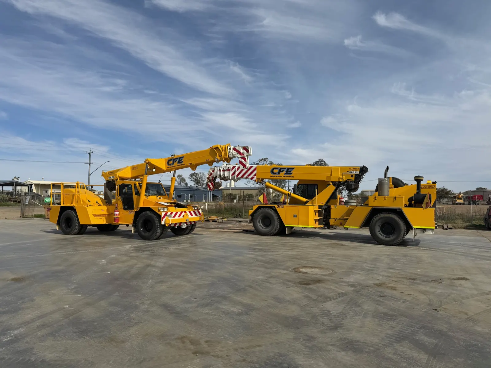 Two CFE Fabrication and Engineering franna cranes parked in the HES yard